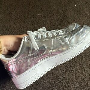 Silver Nike Air Force ones. Men’s 8.5 women’s 10